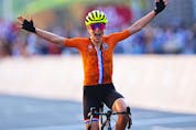Annemiek van Vleuten of Team Netherlands celebrates crosses the finishing line, thinking that she won the gold. July 25, 2021 in Oyama, Shizuoka, Japan.