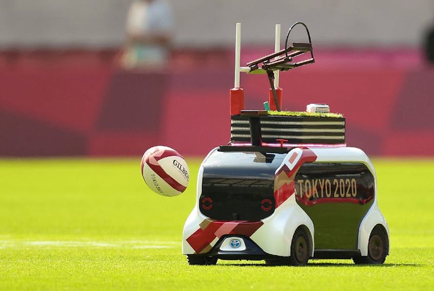  CHOFU, JAPAN – JULY 26: A robot delivers match balls on day three of the Tokyo 2020 Olympic Games at Tokyo Stadium on July 26, 2021 in Chofu, Tokyo, Japan.