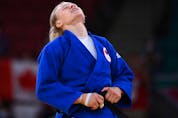  Canada’s Jessica Klimkait reacts after defeating Slovenia’s Kaja Kajzer in the judo women’s -57kg bronze medal B bout during the Tokyo 2020 Olympic Games at the Nippon Budokan in Tokyo on July 26, 2021.