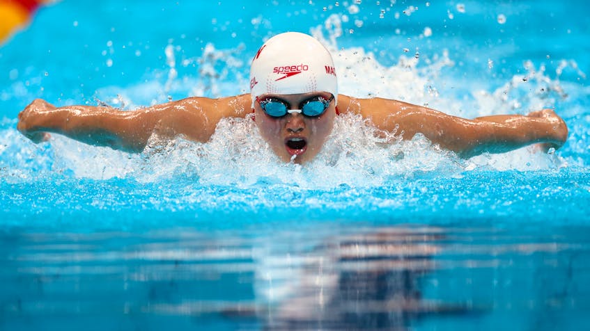 Maggie MacNeil, who has connections to New Waterford, captured Canada's first gold medal at the 2020 Olympic Games in Tokyo on Sunday night, finishing the women's 100-metre butterfly with a time of 55.59 seconds. REUTERS PHOTO.