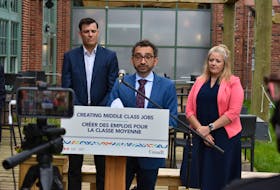 Transport Minister Omar Alghabra, centre, announced $3 million in federal funding for the Charlottetown Airport on July 26. Behind him, left, Doug Newson, CEO of the Charlottetown Airport authority, and Corryn Clemence, CEO of the Tourism Industry Association of P.E.I.