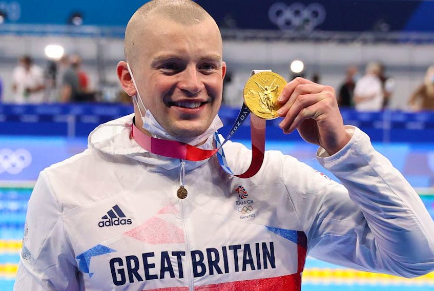  Gold medallist Adam Peaty of Britain poses.