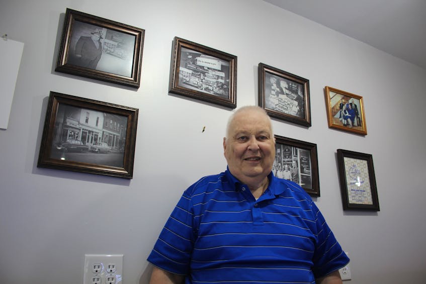 Grant Moase, proprietor, is surrounded by photos of the family business over the years. After 80 years of operation, Moase Quality Jewellers of downtown Summerside has closed its doors for good. - Colin MacLean