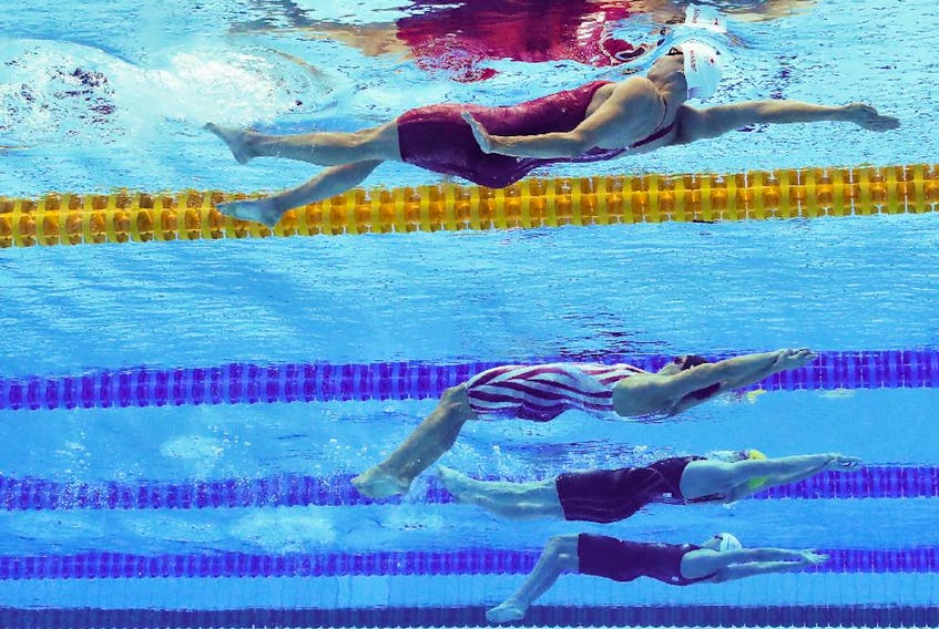  Kylie Masse of Team Canada, Regan Smith of Team United States, Kaylee McKeown of Team Australia and Kathleen Dawson of Team Great Britain compete in the Women’s 100m Backstroke Final on day four of the Tokyo 2020 Olympic Games at Tokyo Aquatics Centre on July 27, 2021 in Tokyo, Japan.