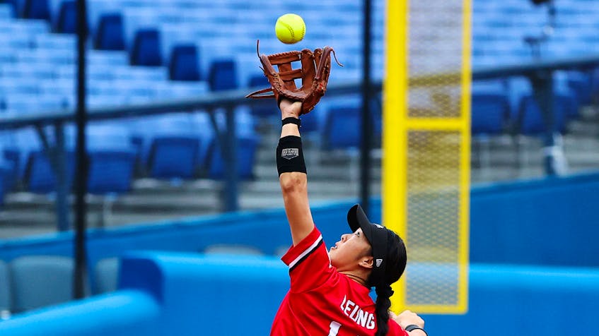 Janet Leung of Canada in action reaches for the ball during her team's bronze-medal women's softball game against Mexico on Tuesday, July 27, 2021 in Yokohama Baseball Stadium in Yokohama, Japan. - Jorge  Silva / Reuters