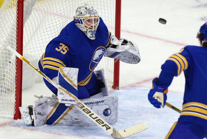 Buffalo Sabres goaltender Linus Ullmark (35) looks to make a save during the first period against the New York Islanders at KeyBank Center  on  Feb. 15, 2021.