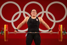  Maude Charron of Team Canada competes during weightlifting in the women’s 64kg weight class.