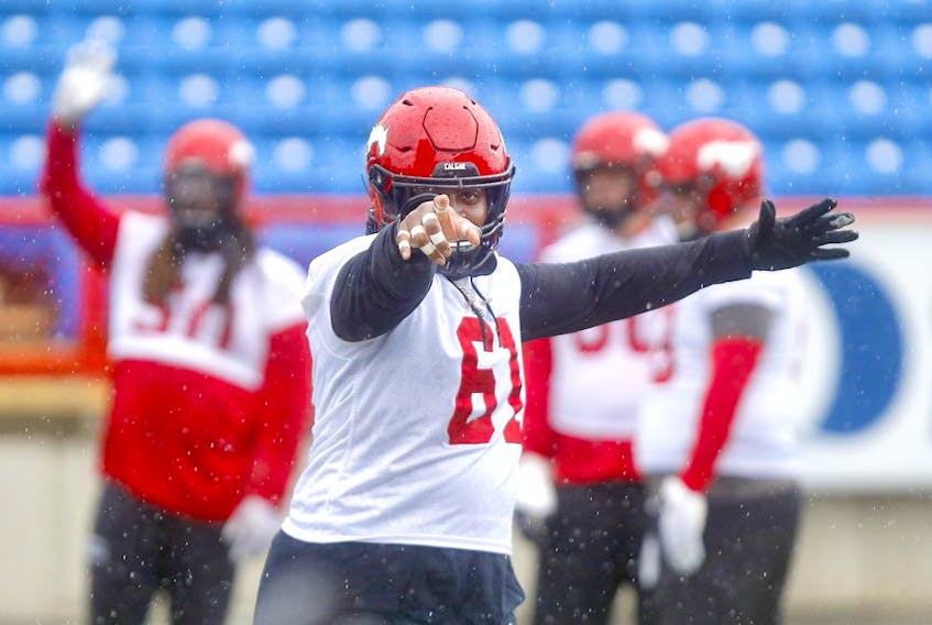 Right back at ya, big man! Calgary Stampeders OL Ucambre Williams has re-signed with the Red &amp; White. File photo by Darren Makowichuk/Postmedia.