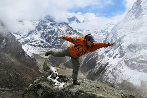 Dr. TA Loeffler - pictured here high atop Mount Everest - still loves to play. Loeffler, who grew up in Alberta and now lives in St. John's, NL, where she is a professor at Memorial University, says Canadian kids have fewer opportunities to enjoy the free-range play she had as a child. 