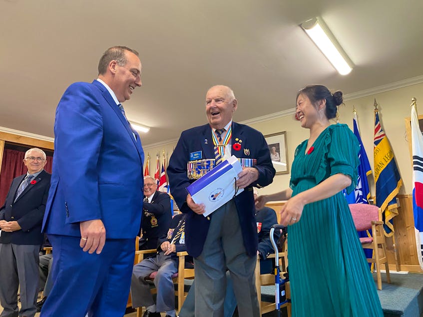 Along with other veterans in attendance, Korean War veteran Bob Garron receives a special presentation during a ceremony at the Wedgeport Legion. Assisting with the presentations were West Nova MP Chris d'Entremont and Korean-born Yarmouth resident Sonia Park-Lawrence. TINA COMEAU 