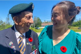 Korean War veteran Nelson Deveau and Korean-born Yarmouth resident Sonia Park-Lawrence share smiles as they exchange phases in Korean following a special ceremony honouring veterans of the Korean War that was held by the Wedgeport Legion Branch 155 on July 24. TINA COMEAU • TRICOUNTY VANGUARD