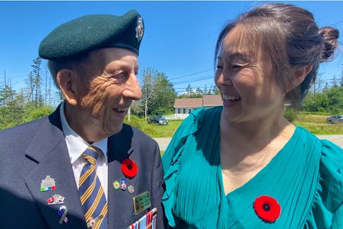Korean War veteran Nelson Deveau and Korean-born Yarmouth resident Sonia Park-Lawrence share smiles as they exchange phases in Korean following a special ceremony honouring veterans of the Korean War that was held by the Wedgeport Legion Branch 155 on July 24. TINA COMEAU • TRICOUNTY VANGUARD