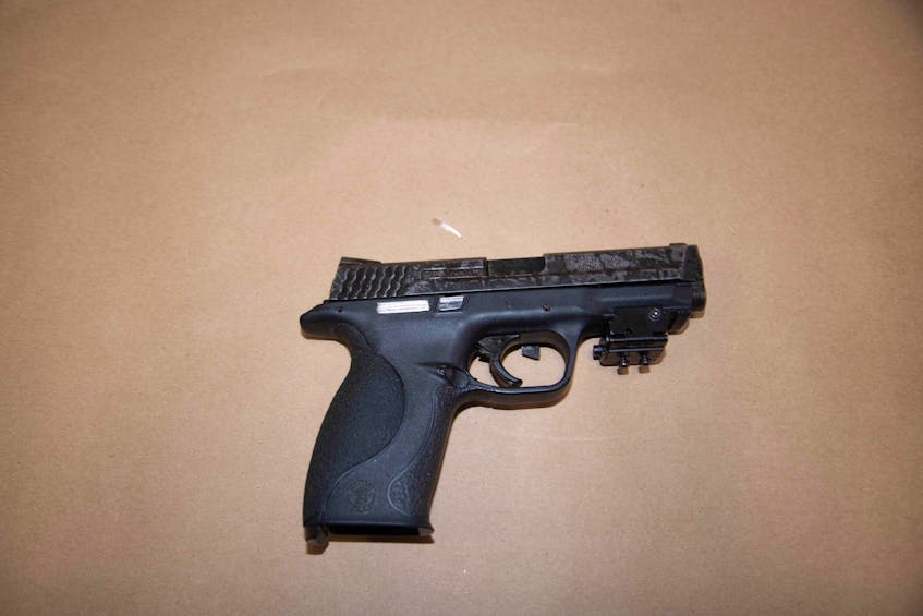 Andrew Jason Hudder had this loaded 9mm Smith & Wesson pistol in a satchel strapped to his chest when police arrested him April 17 after a short, high-speed car chase in Halifax. - Halifax Regional Police