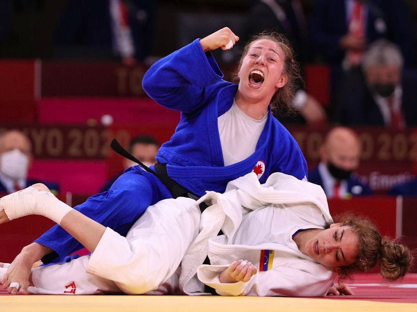 Catherine Pinard-Beauchemin of Team Canada celebrates after defeating Anriquelis Barrios of Team Venezuela during the Women’s Judo 63kg Contest. - Postmedia  photo