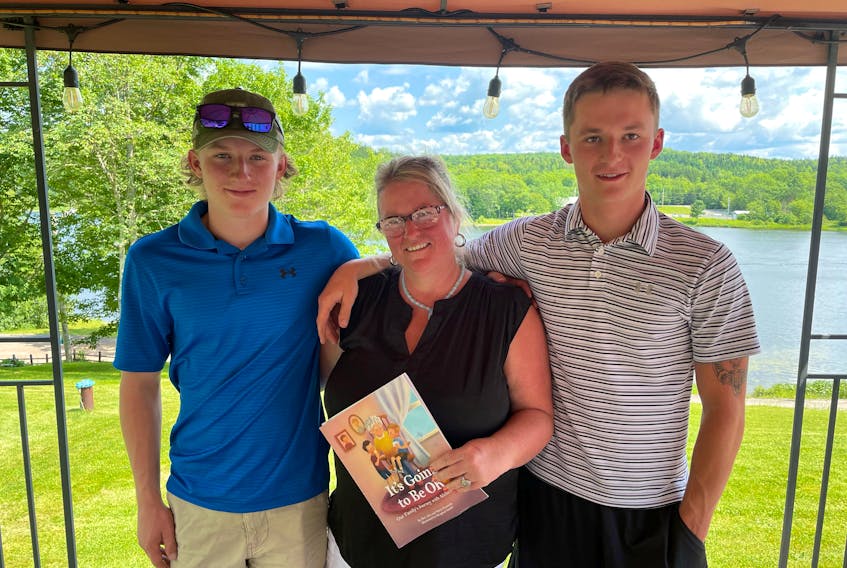 Marie Kennedy and her sons Ben, left, and Alex, recently wrote and self-published the children's book, It’s Going to Be OK, about their journey with Alzheimer’s. The Antigonish, N.S. family experienced Alzheimer's first-hand after Marie's mother was diagnosed with the disease while Alex and Ben were still young children.