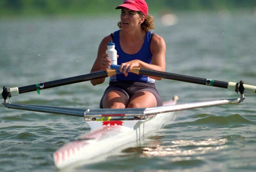  Double gold medalist Marnie McBean who trains out of London, grabs a water break after a hard 1,000 metre sprint at Fanshawe Lake.