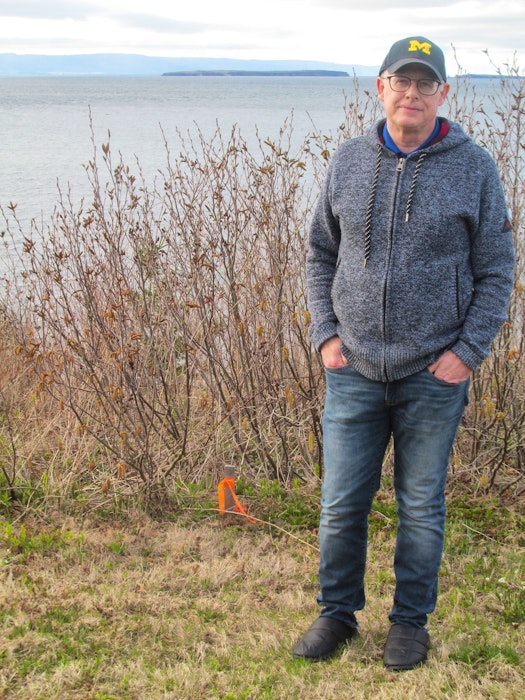 Dr. William Harless has spent several months trying to get answers on the possible construction of a private RV park on what is considered a federally protected lighthouse, located next to his property in Black Rock, Victoria County. IAN NATHANSON • CAPE BRETON POST