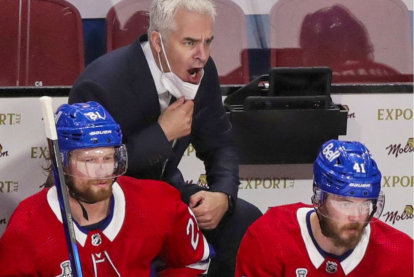 Canadiens interim head coach Dominique Ducharme yells at officials behind the bench during the first period of Game 3 of the Stanley Cup Final against the Tampa Bay Lightning in Montreal on Friday, July 2, 2021. Ducharme was back behind the bench for the first time since having COVID-19.  