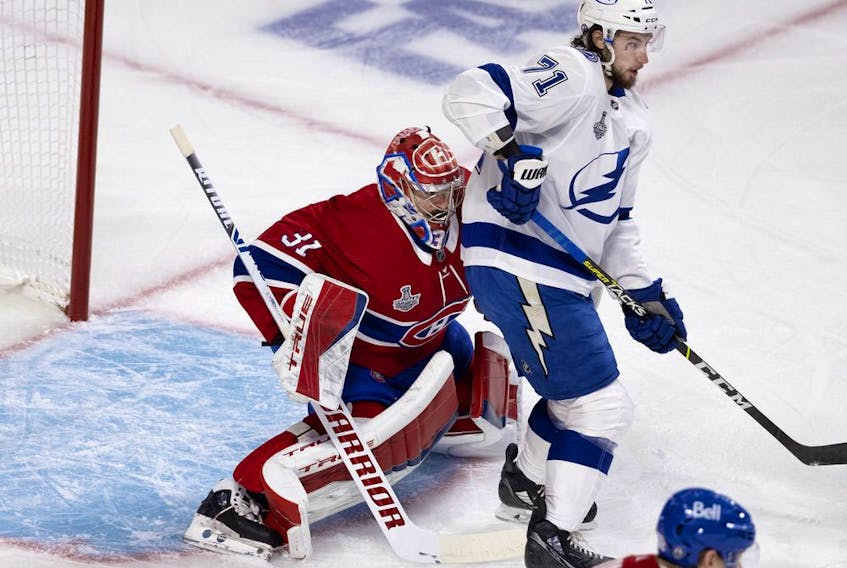 Tampa Bay Lightning centre Anthony Cirelli (71) screens Canadiens goaltender Carey Price just enough to allow the Tampa Bay Lightning to score their second goal  during Game 3 of the Stanley Cup Final in Montreal on Friday, July 2, 2021.  