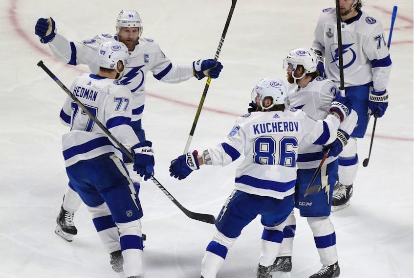 Tampa Bay Lightning players celebrate with defenceman Victor Hedman after his goal during the first period of Game 3 of the Stanley Cup Final against the Canadiens in Montreal on Friday. July 2, 2021. 