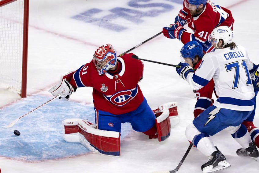 Canadiens goaltender Carey Price makes a save during Game 3 of the Stanley Cup Final against the Tampa Bay Lightning in Montreal on Friday, July 2, 2021. 