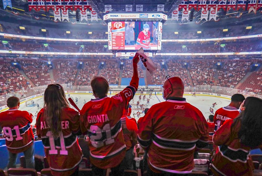 Canadiens fans wave towels during the warm-up prior to a Stanley Cup Final game against the Tampa Bay Lightning in Montreal on Friday July, 2, 2021.  
