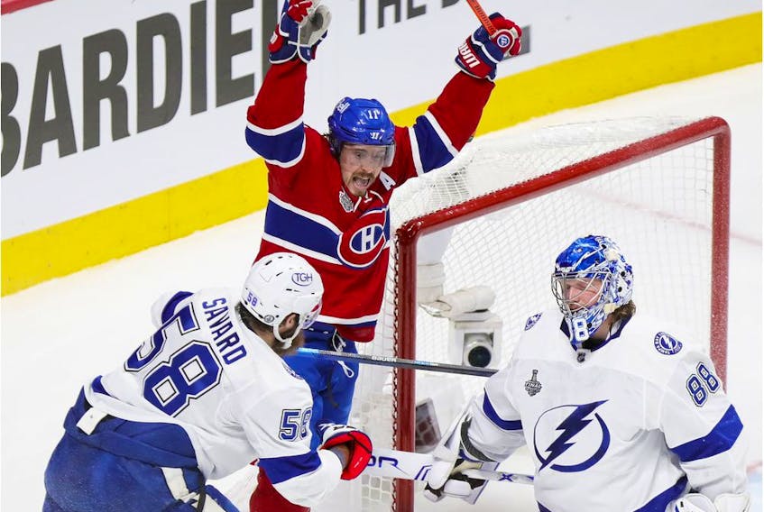 Canadiens' Brendan Gallagher celebrates linemate Phillip Danault's goal past Tampa Bay Lightning goalie Andrei Vasilevskiy and defenceman David Savard during the first period of Game 3 of the Stanley Cup Final in Montreal on Friday, July 2, 2021.  
