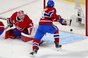 Canadiens defenceman Ben Chiarot tries to reach the puck as shot by Tampa Bay Lightning Victor Hedman trickles past goalie Carey Price for a goal during the first period of Game 3 of the Stanley Cup Final in Montreal on Friday, July 2, 2021.  