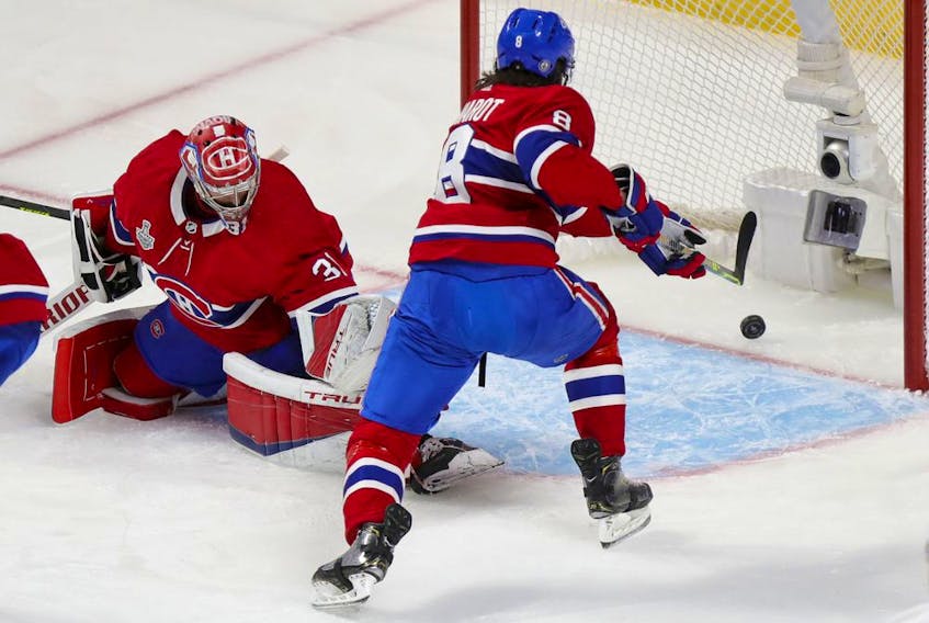 Canadiens defenceman Ben Chiarot tries to reach the puck as shot by Tampa Bay Lightning Victor Hedman trickles past goalie Carey Price for a goal during the first period of Game 3 of the Stanley Cup Final in Montreal on Friday, July 2, 2021.  