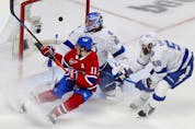 Canadiens' Brendan Gallagher crashes the net as linemate Phillip Danault's shot beats  Tampa Bay Lightning goalie Andrei Vasilevskiy and defenceman David Savard during the first period of Game 3 of the Stanley Cup Final in Montreal on Friday July 2, 2021. 