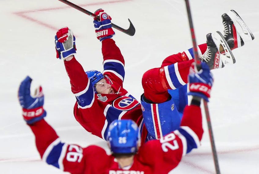 Canadiens' Josh Anderson lies on his back as he celebrates his winning goal in overtime during Game 4 of the Stanley Cup final Monday night at the Bell Centre.