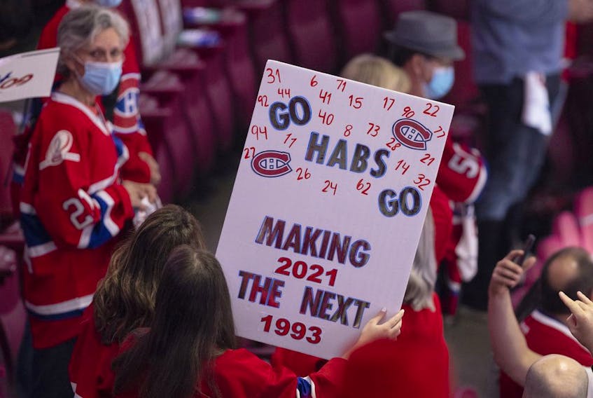 Habs fans cheer during the pregame skate during Game 3 of the Stanley Cup Final between the Canadiens and the Tampa Bay Lightning in Montreal on Friday, July 2, 2021. 