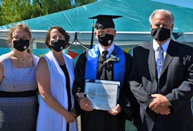 With his high school graduation diploma for adults in hand, Charles Trenholm says he can now finish anything he sets his mind to. Pictured congratulating the 71-year-old on his accomplishment were the school’s teachers, Tatyana Currie, Joanne MacGillivray, and Greg Mackin.