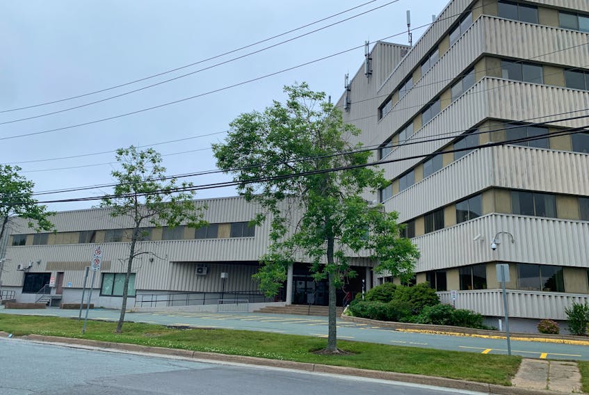 An empty parking lot is seen at Dartmouth provincial court after it closed in relation to a threats call on Tuesday, July 6, 2021, Halifax Regional Police said.