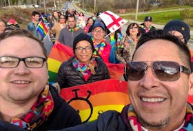 Geordy Marshall, left, co-founder of Pride Eskasoni, and John R. Sylliboy, right, of the Wabanaki Two-Spirit Alliance, leading the first Pride parade in Eskasoni First Nation in 2016. Eskasoni was the first Mi'kmaw community to hold a Pride event, and is now helping others to start their own festivals. CONTRIBUTED 