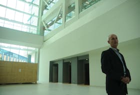 Mark Abrahams, provost and vice-president (academic) pro tempore of Memorial University, speaks in the main atrium of the new core science building.