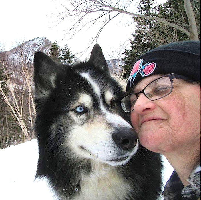 Arlene Fougere of Meat Cove with her beloved husky Cooper at an earlier date. Contributed
