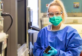 Lab- Q7441 Hayley Gillis, a Medical Laboratory Assistant, Halifax,   performs maintenance on the Magnapure nucleic acid extractor, used  to test for Covid-19 GOVERNMENT OF NOVA SCOTIA PHOTO
