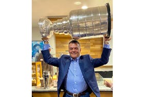 Summerside's Grant Sonier lifts the Stanley Cup after the Tampa Bay Lightning defeated the Montreal Canadiens on July 7. Sonier is an amateur scout with the Lightning.