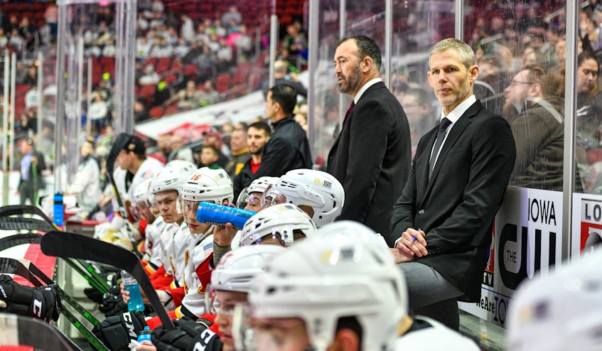 Cail MacLean watches the action during his time as the head coach of the AHL's Stockton Heat. - Calgary  Flames