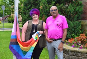 Truro Pride Society board member Melissa Howell and Truro Deputy Mayor Wayne Talbot raised the Progress Pride flag in Truro