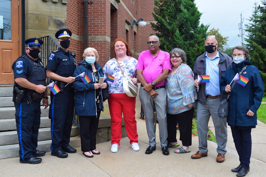 Truro police, local politicians and community members were present. Left to right: Truro Police officers Sgt. Rick Hickox and Chief David MacNeil, Colchester County Mayor Christine Blair, Truro Pride representative Laura Whiteland, Truro Deputy Mayor Wayne Talbot, Councillor Cathy Hinton, Truro-​Bible Hill-Millbrook-Salmon River MLA Dave Ritcey and Councillor Juliana Barnard. - Chelsey Gould
