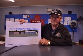 Clair Sweet, president of the interim Western Curling Club board, shows an architect's image of the new club planned for Mill River Resort.