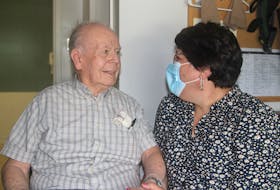 Joyce d’Entremont, CEO/administrator for Mountains and Meadows Care Group, speaks with Mountain Lea Lodge resident Albert Decker on Aug. 5 at the Bridgetown nursing home.
