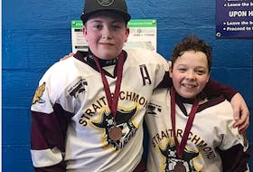 Leeland MacNeil, 15, left, is shown with his best friend Hunter Chisholm three years ago, when they were members of the Peewee A Strait Richmond Pirates hockey team. Leeland is credited with recently saving his friend’s life by taking immediate action after Hunter was hit by a dump truck. CONTRIBUTED