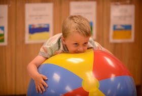 Mattéo plays on a ball at the Carrefour de l'Isle-Saint-Jean at a recent funding announcement. Meetings took place last week between officials with the province’s Chief Public Health Office and Department of Education on a back-to-school plan. Jason Malloy • SaltWire File