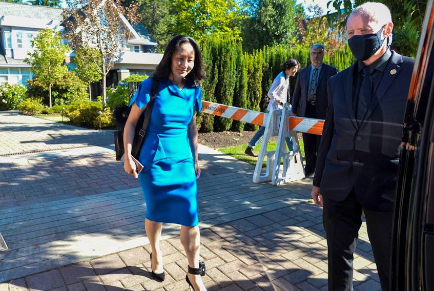 Huawei Technologies Chief Financial Officer Meng Wanzhou leaves her home to attend a court hearing in Vancouver on Aug. 4, 2021. 