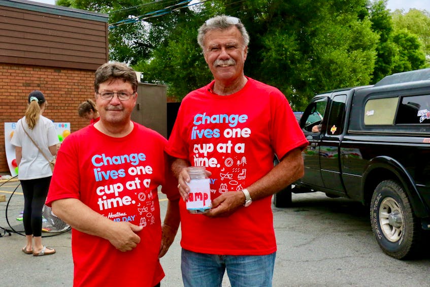Retiring politician Chuck Porter and Hants West candidate Brian Casey were among the many guests who helped solicit extra funds for Camp Day. Porter has been participating in the annual fundraiser for about 25 years. - Carole Morris-Underhill