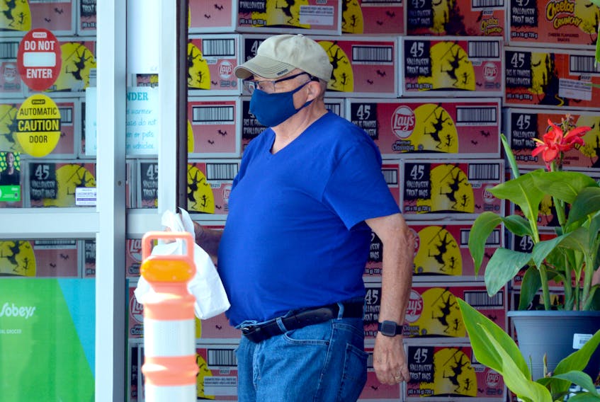 A shopper leaves Sobeys on Topsail Road Tuesday afternoon, Aug. 10, in St. John's after a mask mandate was lifted in the province. On Wednesday, the Newfoundland and Labrador government announced there were no new cases of COVID-19 and one new recovery.
