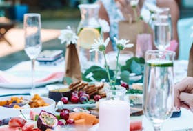 Adding colour to the summer dinner table is as easy as wildflowers and colourful food and drink.